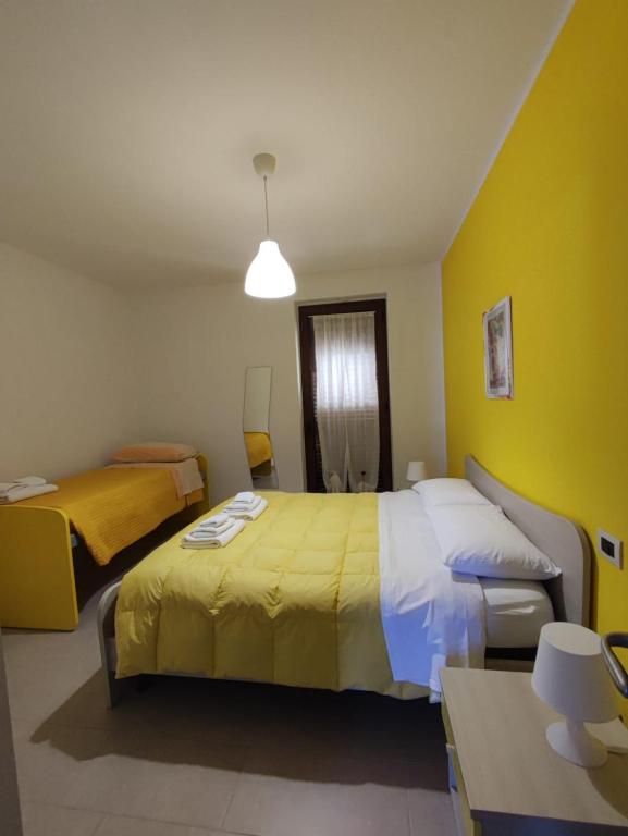 Postel nebo postele na pokoji v ubytování Prima Luce