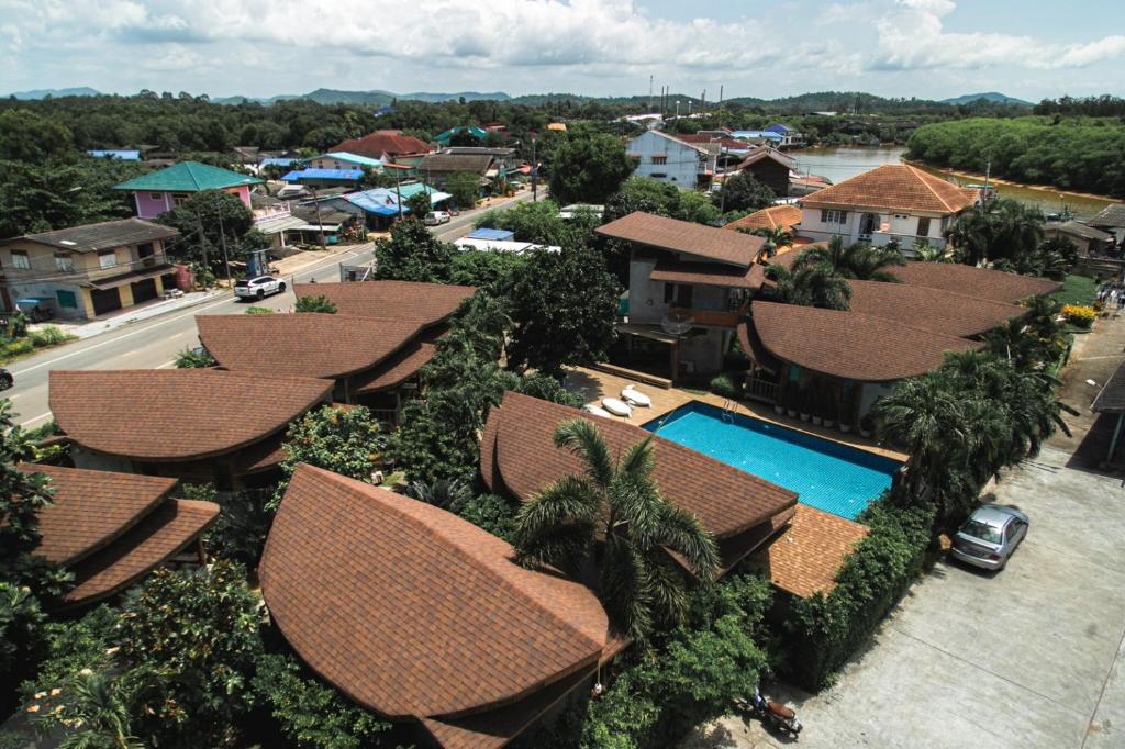 an aerial view of a resort with a swimming pool at Tique Series Boutique Resort (SHA Extra Plus) in Ban Hat Lek