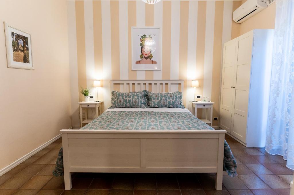 Postel nebo postele na pokoji v ubytování B&B Le Sorelle