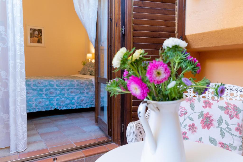 Postel nebo postele na pokoji v ubytování B&B Le Sorelle