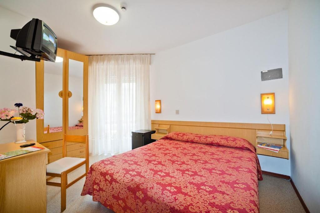Postel nebo postele na pokoji v ubytování Hotel Bianchi