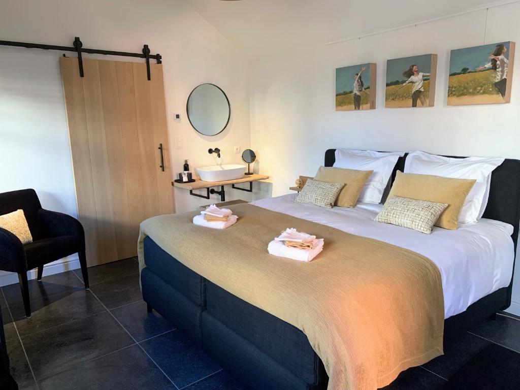 Postel nebo postele na pokoji v ubytování B&B 't klein GELUK