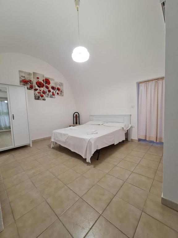 Postel nebo postele na pokoji v ubytování Aria di Sale Polignano