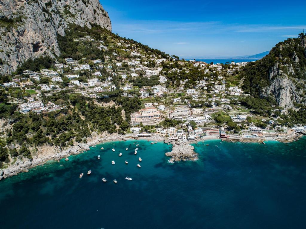 an aerial view of a small town on a mountain at Hotel Weber Ambassador in Capri