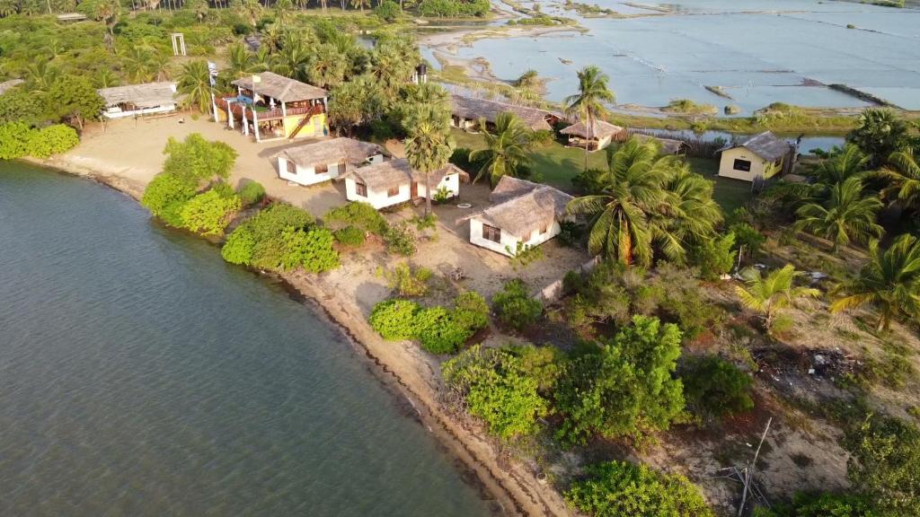 an aerial view of a house on an island in the water at MKS - Kite & Wing Foil camp in Kalpitiya