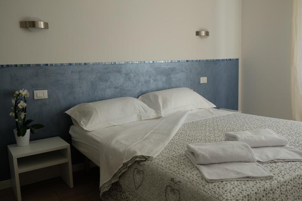Łóżko lub łóżka w pokoju w obiekcie Appartamenti Bellini