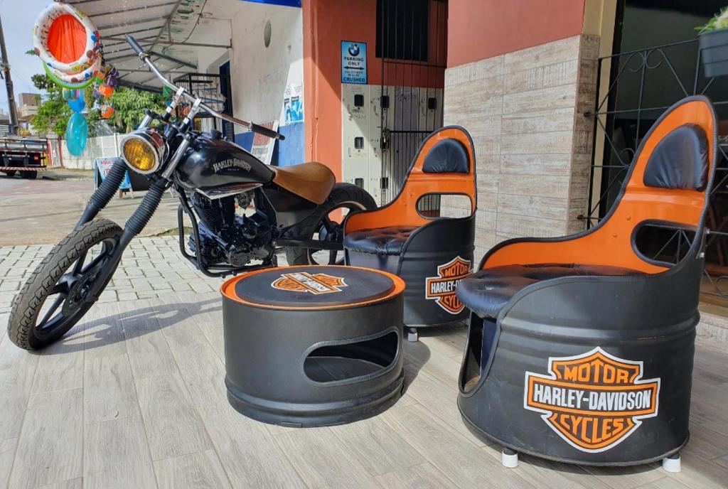 a motorcycle parked in front of a building at Pousada Mar e Moto in Guaratuba