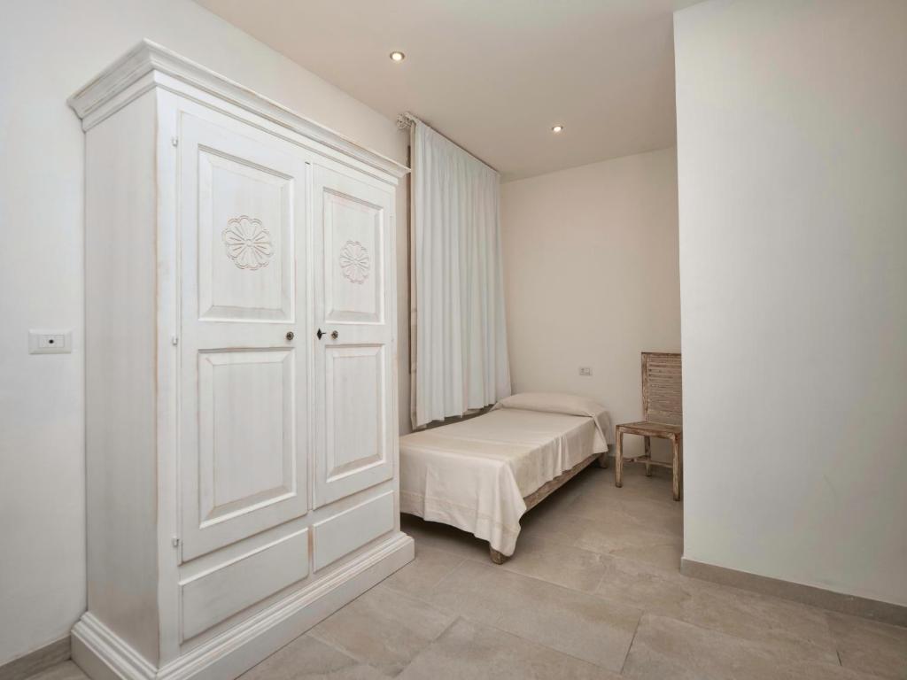 Łóżko lub łóżka w pokoju w obiekcie Iside Accommodations