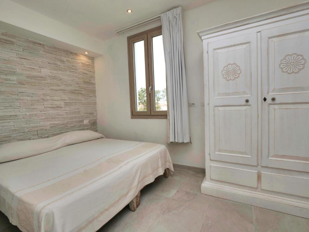 Łóżko lub łóżka w pokoju w obiekcie Iside Accommodations