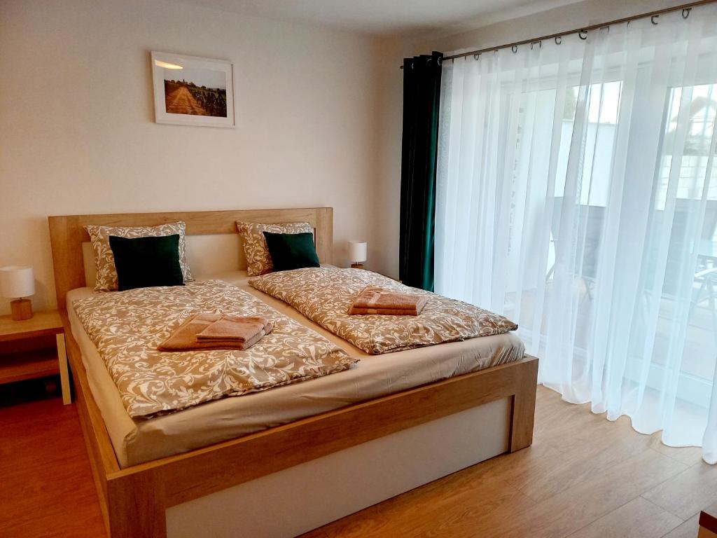 Postel nebo postele na pokoji v ubytování Apartmány Olšovská