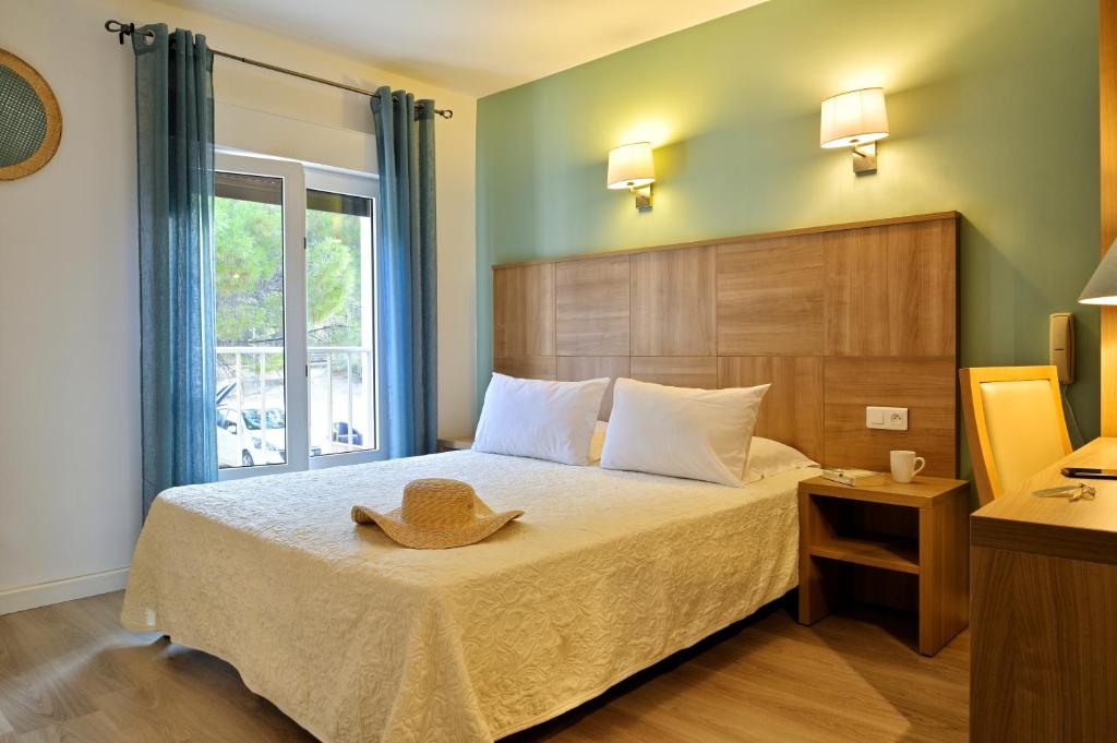 Postel nebo postele na pokoji v ubytování Hotel Beau Rivage