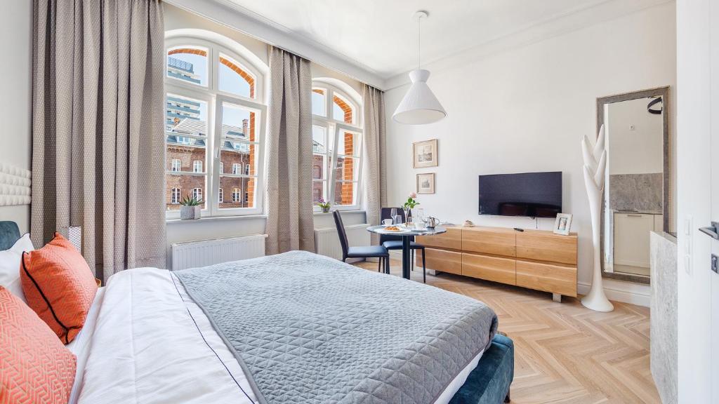 Televízia a/alebo spoločenská miestnosť v ubytovaní Grey Apartments - Waterlane Vintage