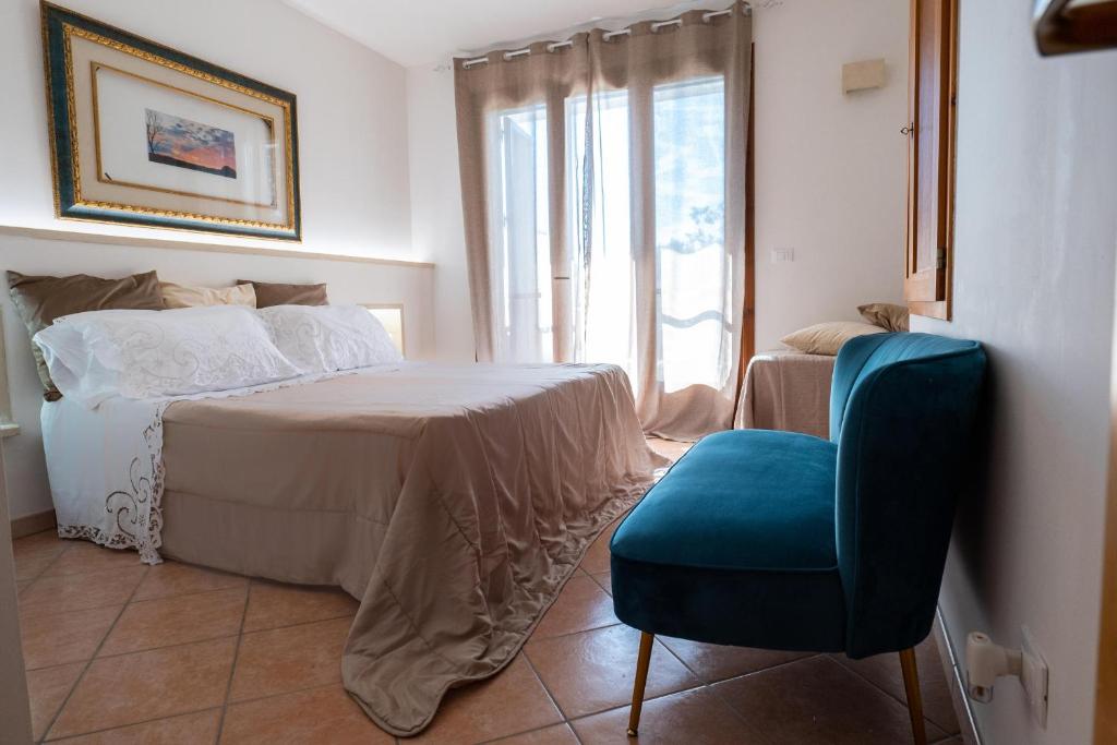 Postel nebo postele na pokoji v ubytování Missipezza Residence a Frassanito
