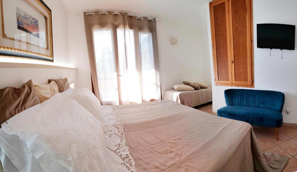 Postel nebo postele na pokoji v ubytování Missipezza Residence a Frassanito