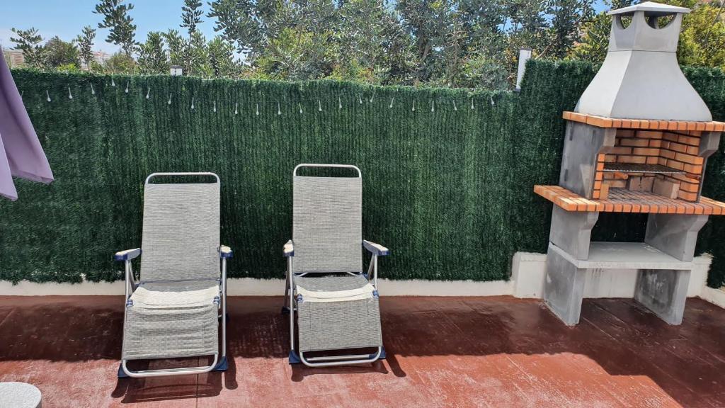 Balkón nebo terasa v ubytování CALA HOUSE II Luminoso adosado con vistas,piscina comunitaria y parking incluido