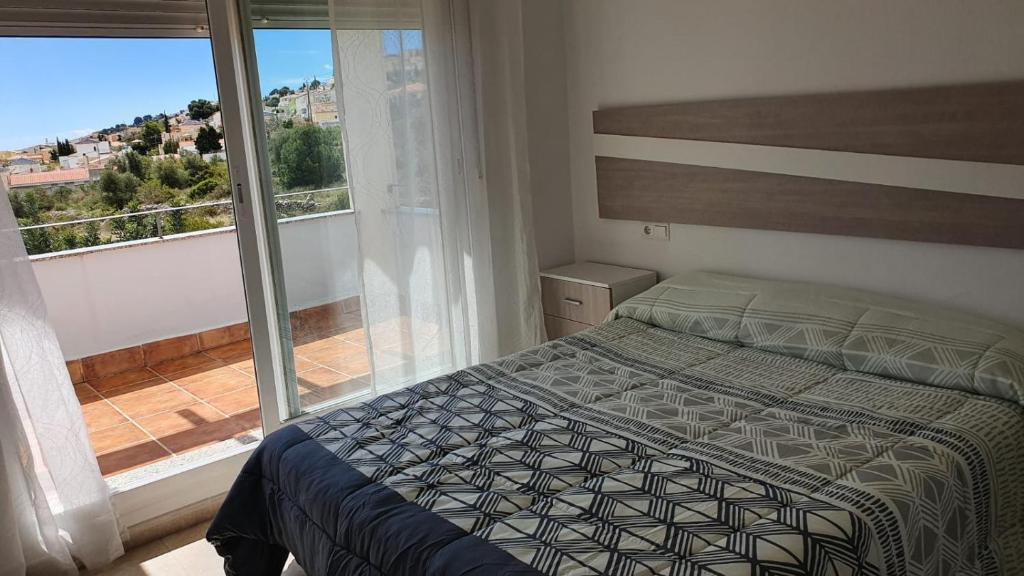 Postel nebo postele na pokoji v ubytování CALA HOUSE II Luminoso adosado con vistas,piscina comunitaria y parking incluido