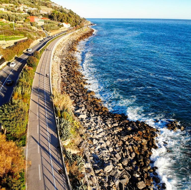 an aerial view of a road and the ocean at Luxury Tugurio in Arma di Taggia