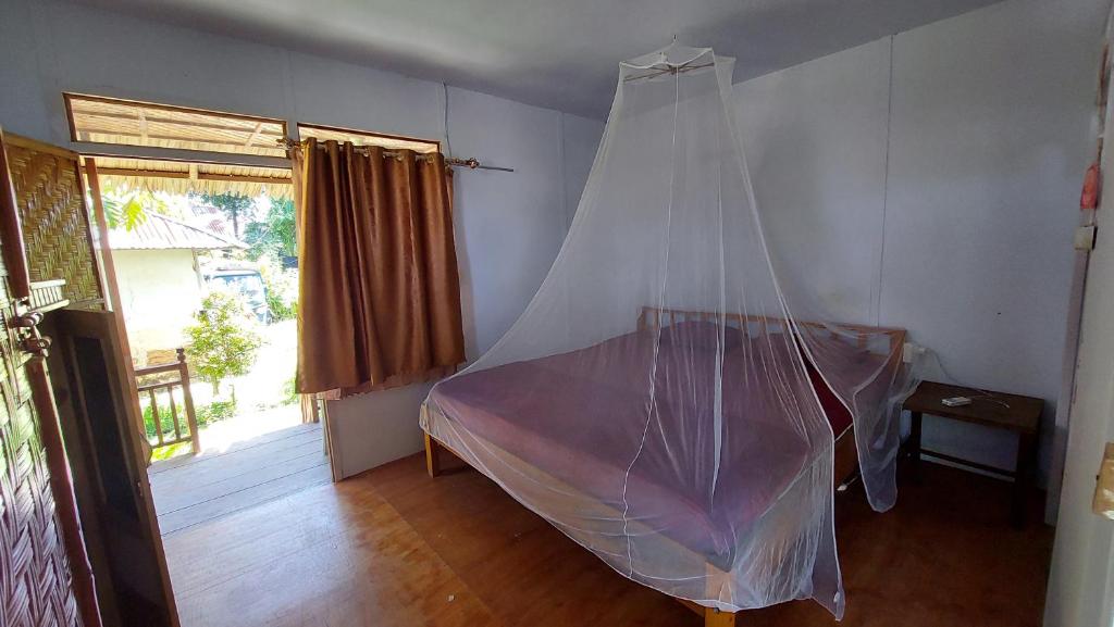 Letto o letti in una camera di Sunset Homestay by Harry & Mimin
