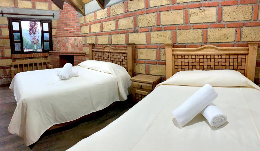 Postel nebo postele na pokoji v ubytování Hotel La Condesa