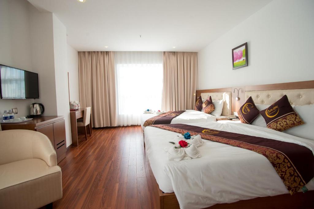 Postel nebo postele na pokoji v ubytování Centre Hotel