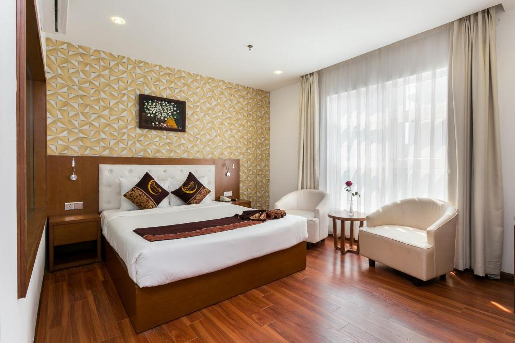 Postel nebo postele na pokoji v ubytování Centre Hotel