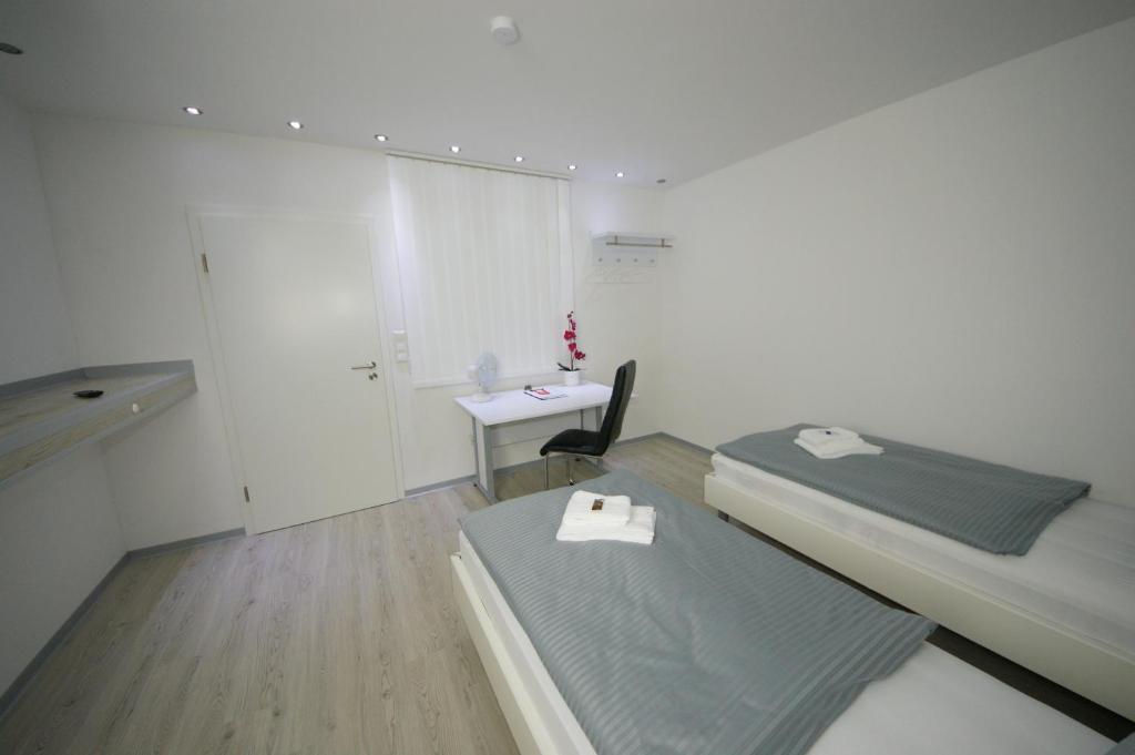 Postel nebo postele na pokoji v ubytování Hotel am Rosenplatz,24 Stunden Check in, kostenfreie Parkplätze