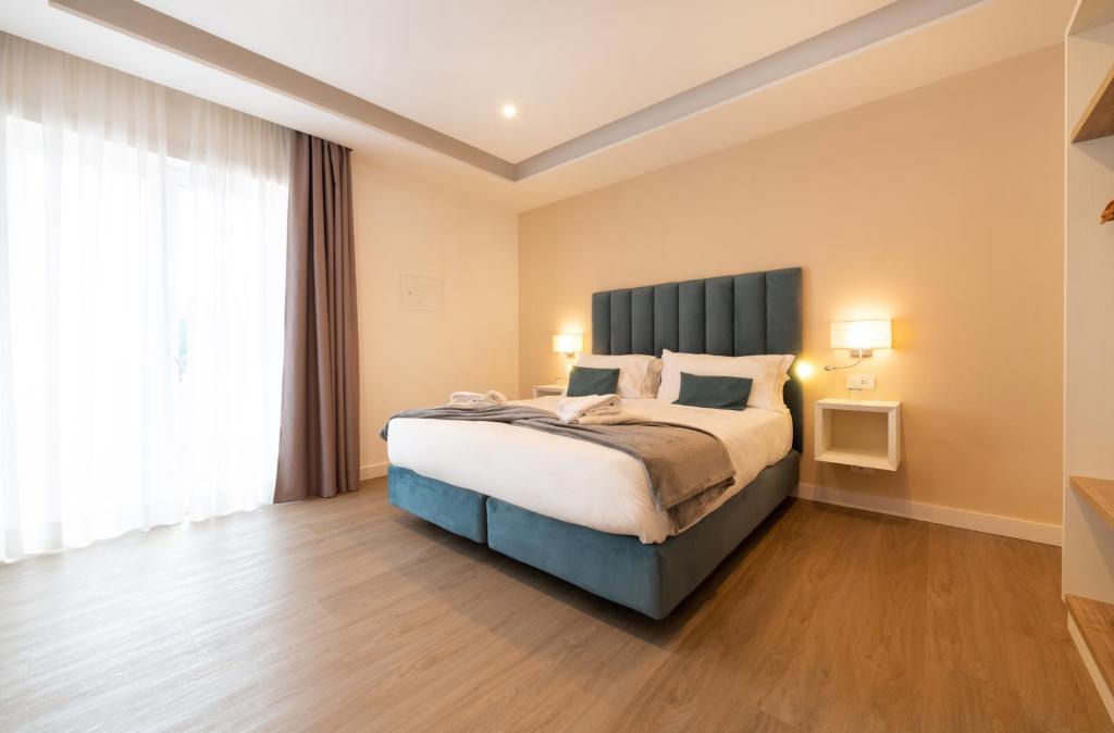 Postel nebo postele na pokoji v ubytování Hotel Sorrento City