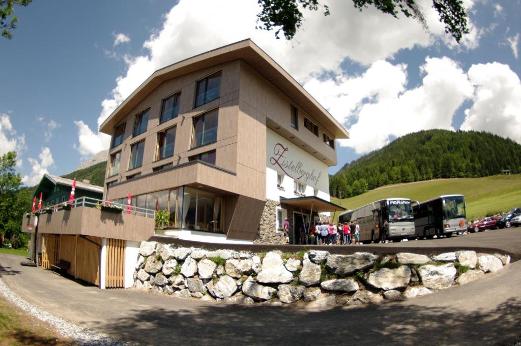 a building with people standing outside of it at Zistelberghof in Werfenweng