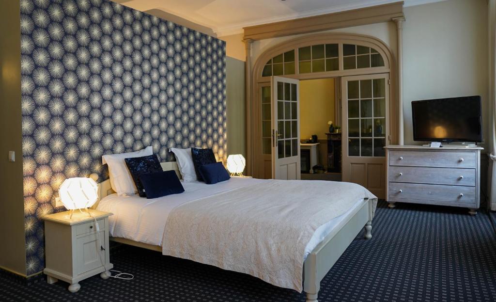 Кровать или кровати в номере Hotel de Flandre Ghent