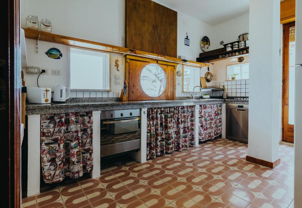 Кухня или мини-кухня в Cuore di Ognina - Appartamenti vista mare
