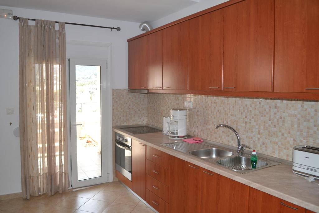 Kuchyň nebo kuchyňský kout v ubytování Bali House