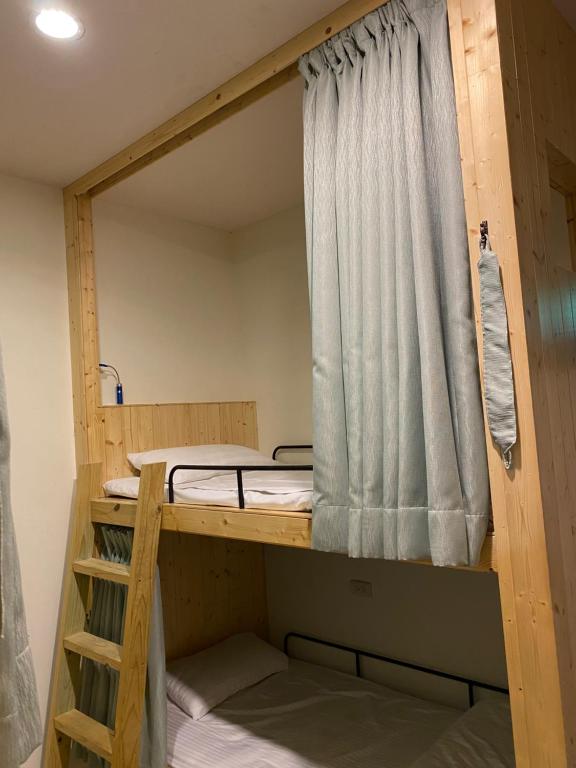 a couple of bunk beds in a room at Kenting Heng-Chung Art Hostel in Hengchun