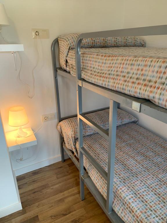 A bed or beds in a room at Mas Pinell 3 -Viu bé