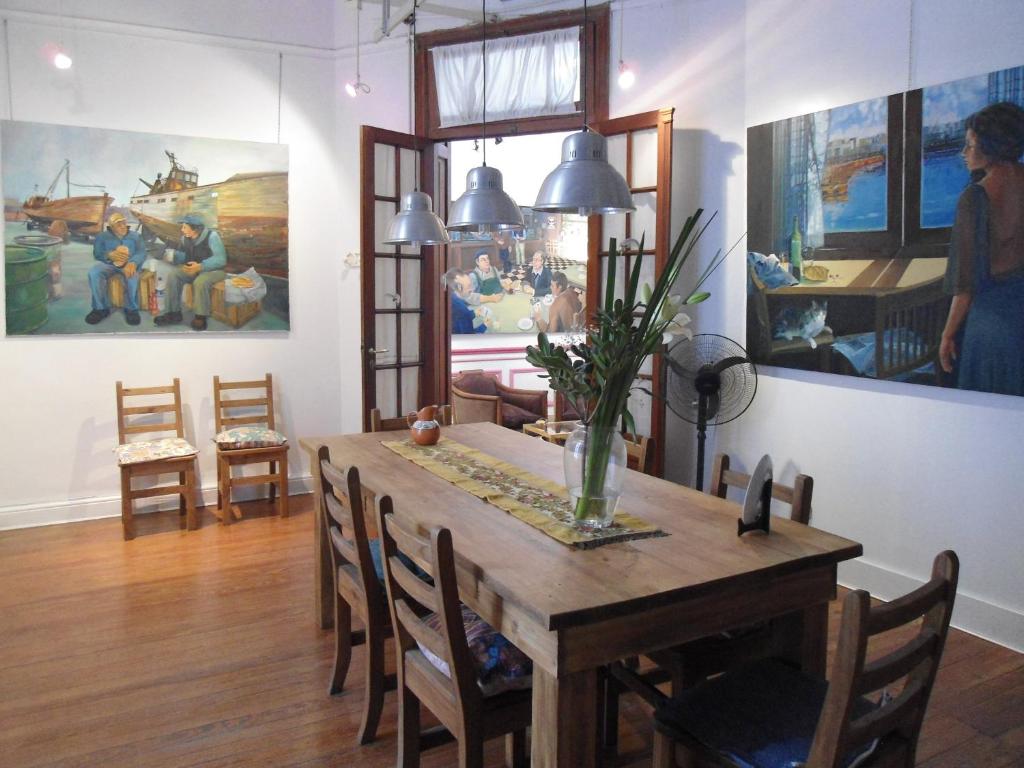 a dining room with a table and chairs at Tango Cozy Home in Buenos Aires