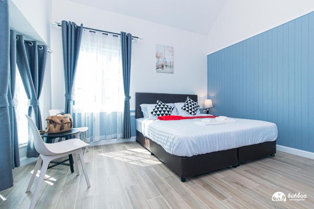 Postel nebo postele na pokoji v ubytování สวนจันท์วาส รีสอร์ท - Suan Chanthwad Resort