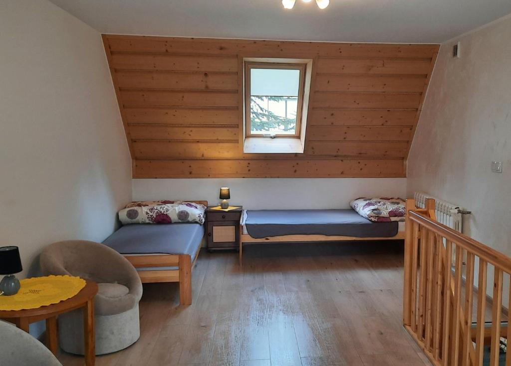 Posteľ alebo postele v izbe v ubytovaní Apartament dwupoziomowy u Samków