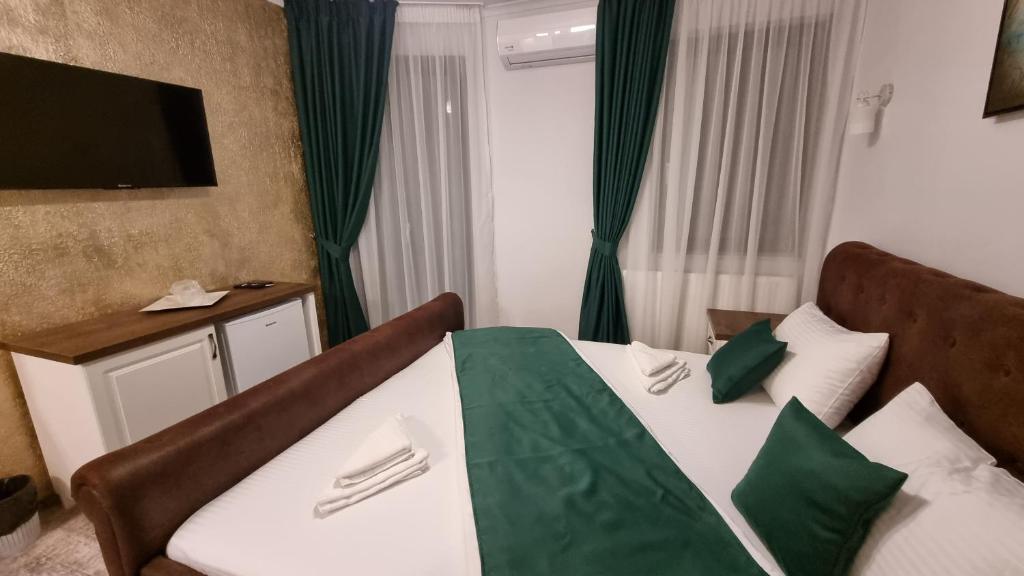 Postel nebo postele na pokoji v ubytování Vila Bun