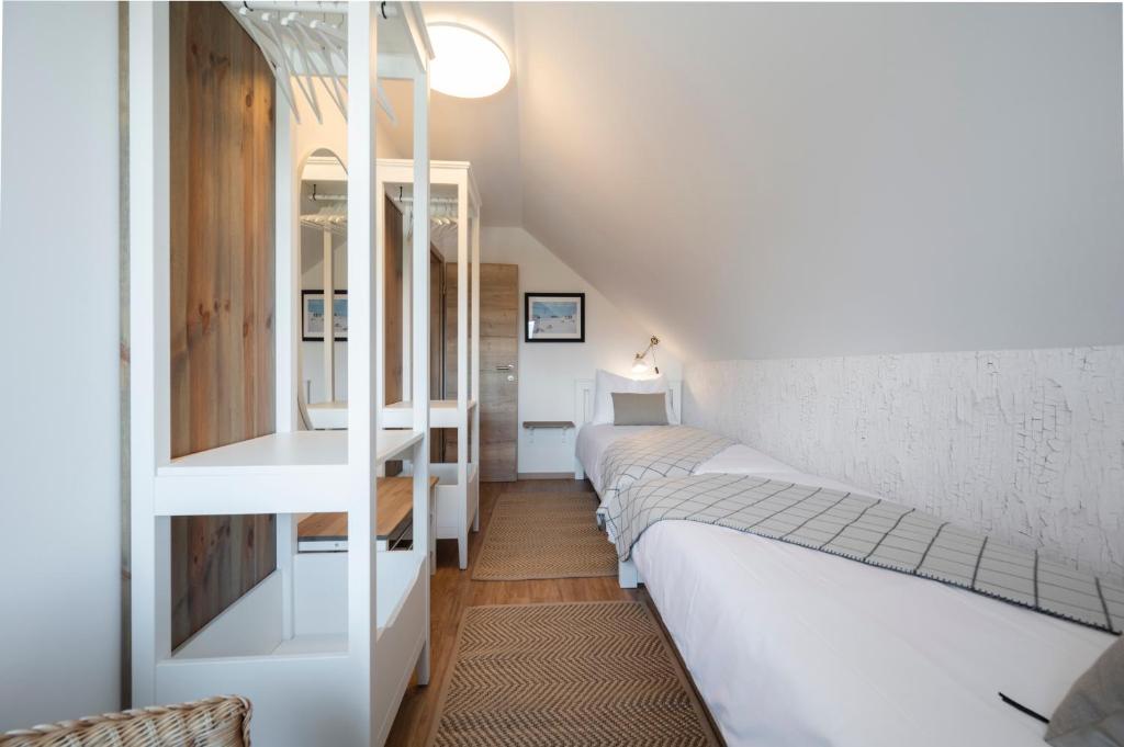 Postel nebo postele na pokoji v ubytování GrosAlp apartments