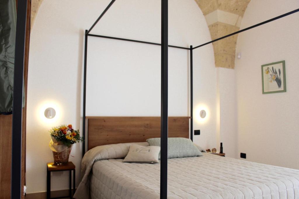 Postel nebo postele na pokoji v ubytování Masseria Rifisa AgriResort