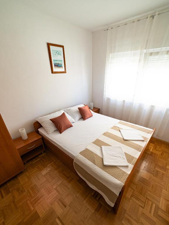 Postel nebo postele na pokoji v ubytování Apartments M&S