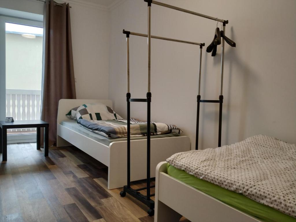 Ένα ή περισσότερα κρεβάτια σε δωμάτιο στο Mehrfamilien Haus