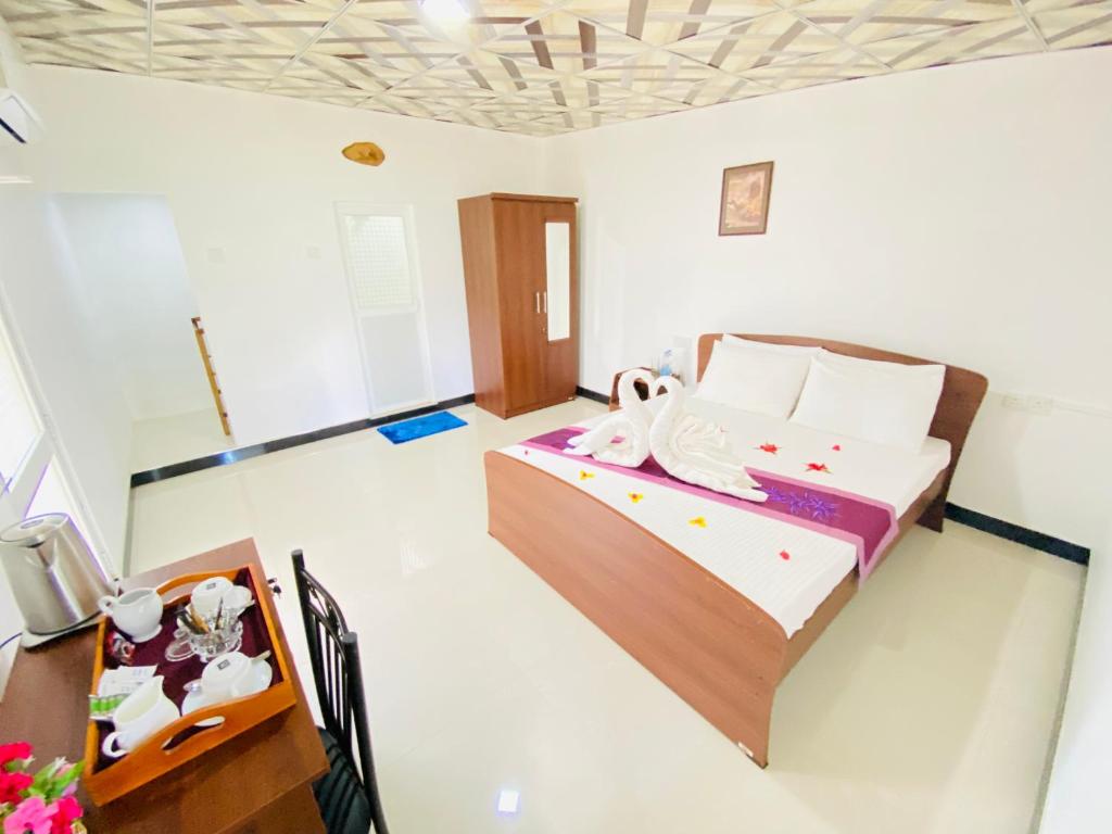 Postel nebo postele na pokoji v ubytování Ima Villa Sigiriya