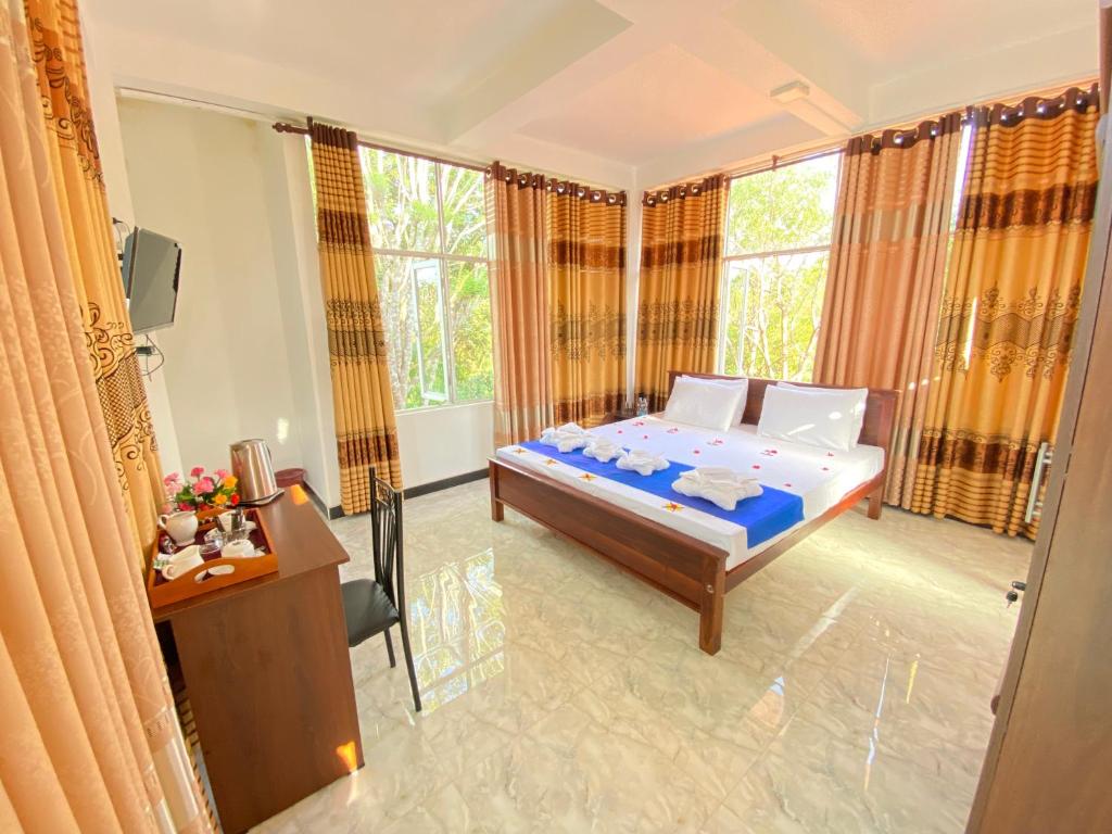 Postel nebo postele na pokoji v ubytování Ima Villa Sigiriya
