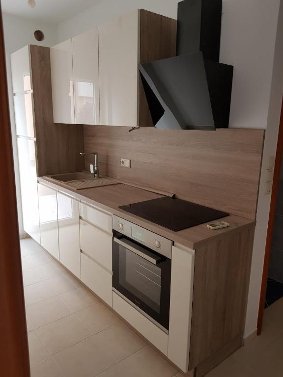 Kuchyňa alebo kuchynka v ubytovaní Apartman Garden