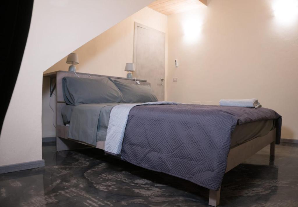 Postel nebo postele na pokoji v ubytování Via Cavour 19, Camere del Conte