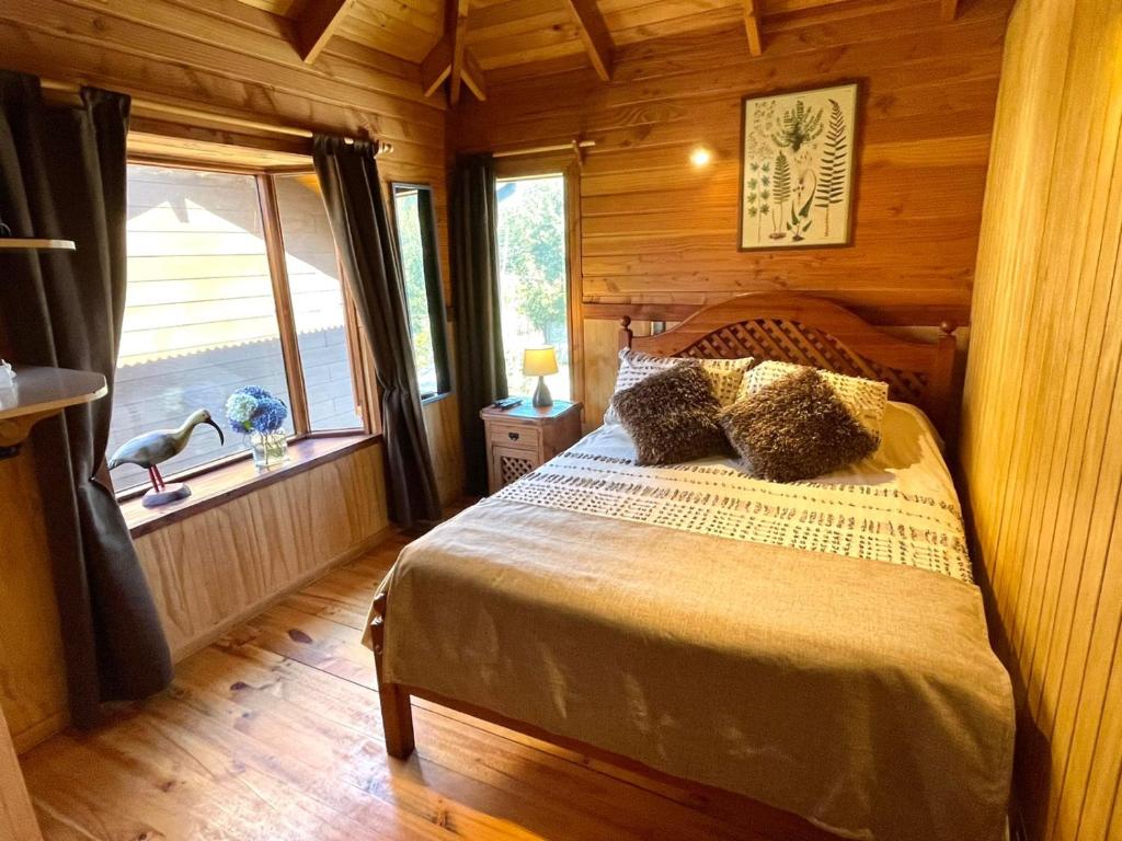 Postel nebo postele na pokoji v ubytování Hostal Pucon Sur