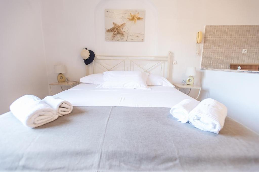 Postel nebo postele na pokoji v ubytování Joanna Apart - Hotel