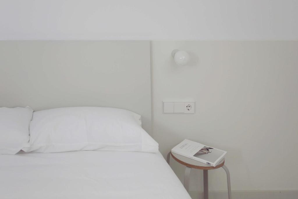 Postel nebo postele na pokoji v ubytování HOTEL LA FONDA B&B