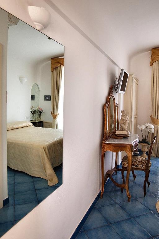 Postel nebo postele na pokoji v ubytování Hotel Bussola