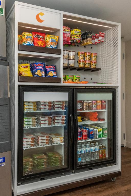 a refrigerator filled with lots of food and drinks at Comfort Inn in Ottawa